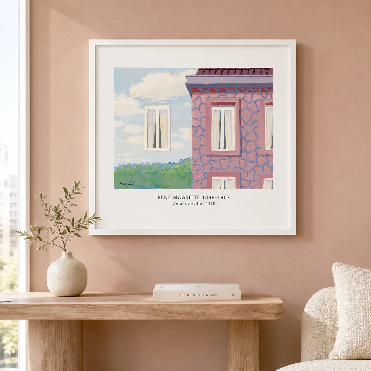 Room mockup of L'etat de Veille Print, Magritte Patterned House Art, displayed as framed wall art in a living room setting as a landscape print with blue and pink tones.