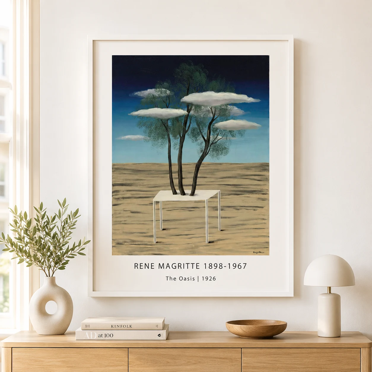 Room mockup of Magritte Desert Trees Print, Tabletop Surreal Landscape, displayed as framed wall art in a living room setting as a portrait print with white tones.