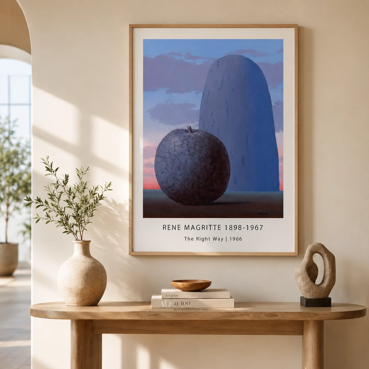 Room mockup of Magritte Stone Apple Print, The Right Way Surreal Wall Art Print, displayed as framed wall art in a living room setting as a portrait print with blue tones.