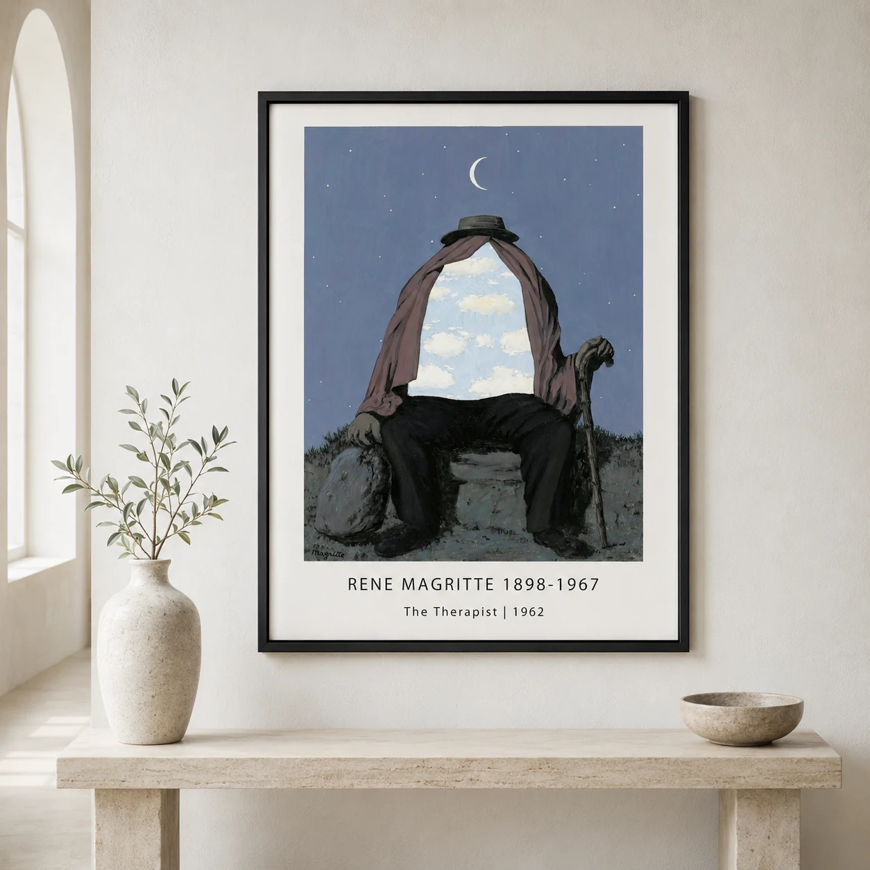 Room mockup of Magritte Therapist Poster, Bowler Hat Surreal Wall Art Print, displayed as framed wall art in a living room setting as a portrait print with black and white and red tones.