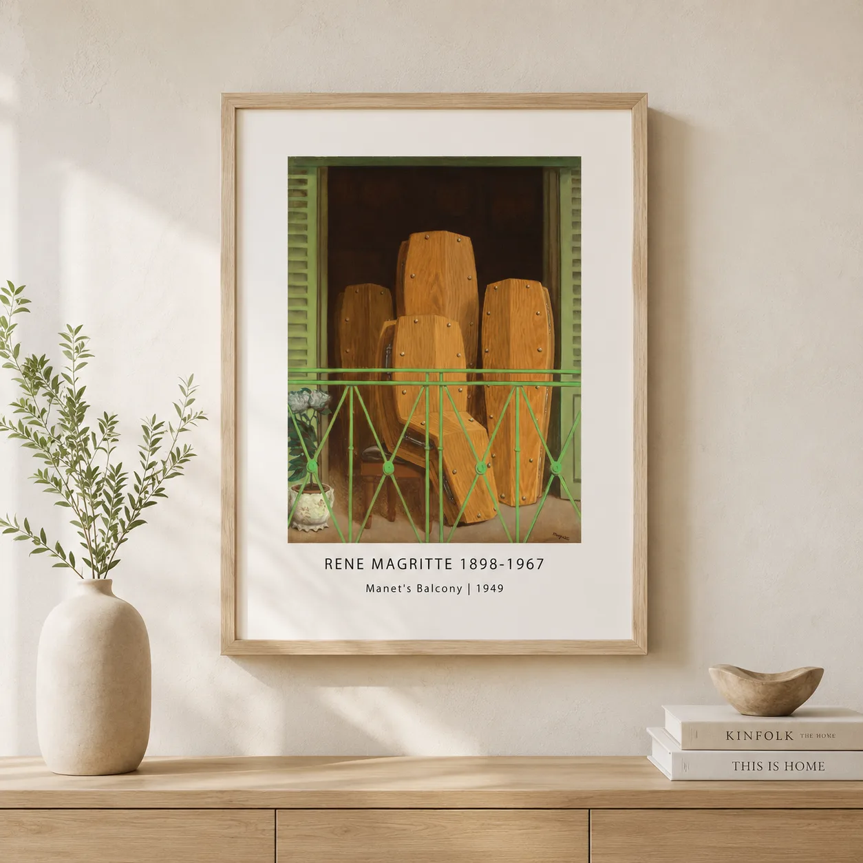 Room mockup of Manet Balcony Print, Magritte Coffin Balcony Wall Art Print, displayed as framed wall art in a living room setting as a portrait print with green tones.