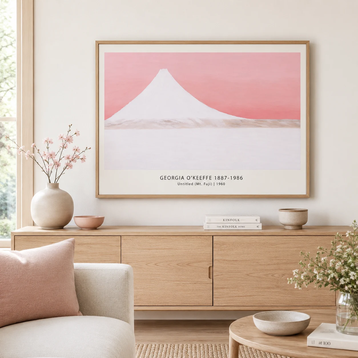 Room mockup of Mt Fuji, Georgia O'Keeffe Modernist Mountain Wall Art Print, displayed as framed wall art in a living room setting as a landscape print with blue and pink tones.