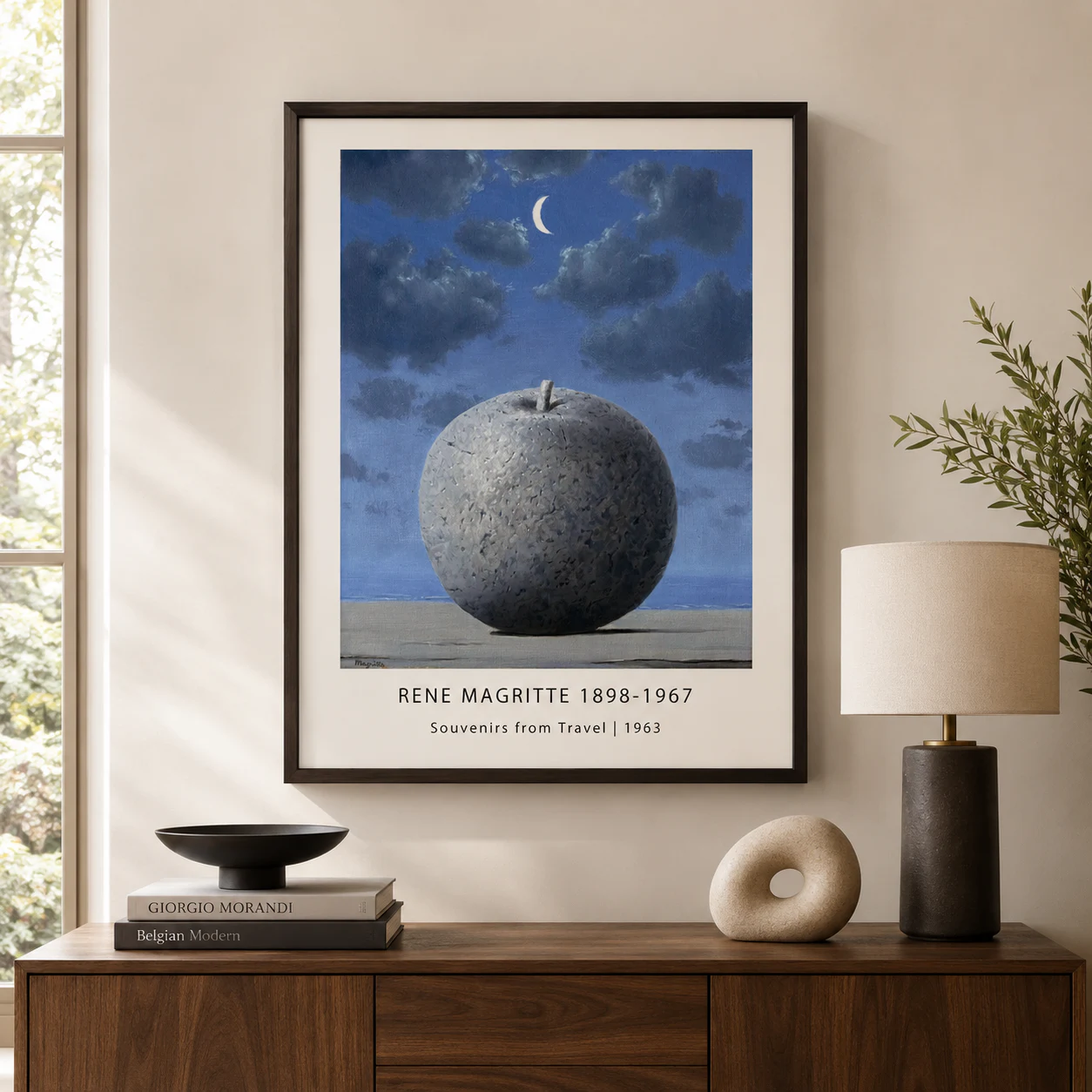 Room mockup of Souvenir de Voyage Print, Magritte Stone Apple Wall Art Print, displayed as framed wall art in a living room setting as a portrait print.
