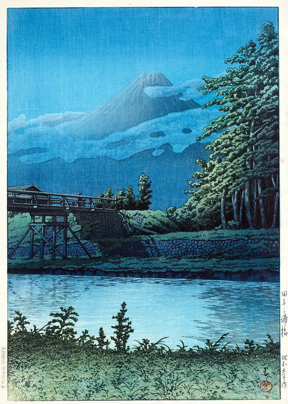 Classic Tagonoura Bridge Print - 1930 Hasui Style Japanese Wall Art Tagonoura Bridge Print Showing A Wooden Bridge Over A River With Mount Fuji And Blue Clouds In The Background.