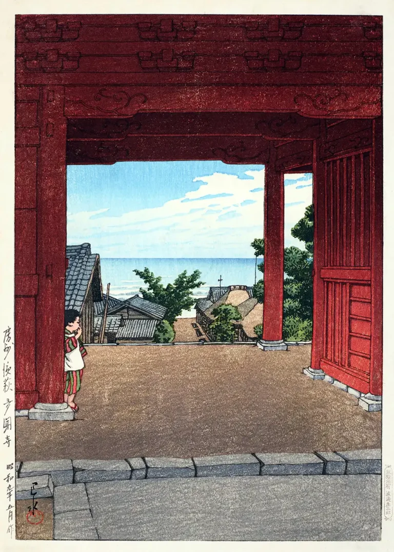 Tamon Temple Hamahagi Awa — vibrant red temple gate frames a peaceful view of a coastal Japanese