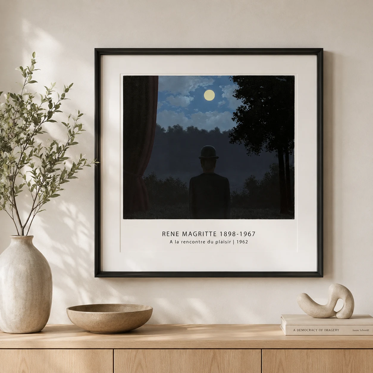 Room mockup of Towards Pleasure Print, Bowler Hat Moon Surreal Wall Art Print, displayed as framed wall art in a living room setting as a landscape print with blue tones.