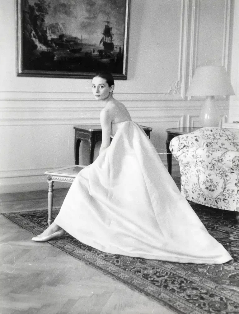 Audrey Hepburn Nuns Story Film print showing at a dress fitting with hubert de givenchy for the premiere of the nun's story,