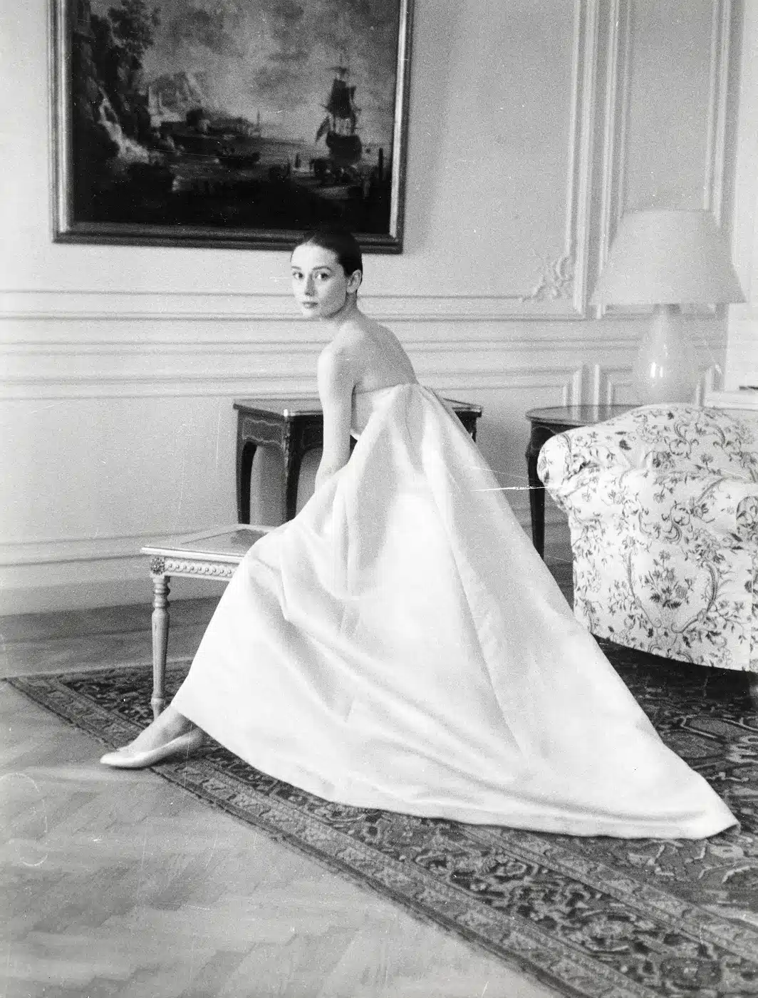 Audrey Hepburn Nuns Story Film print showing at a dress fitting with hubert de givenchy for the premiere of the nun's story,