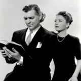 Clark Gable Reading a Script with Co-star Studio Still Photography Print