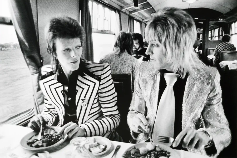 David Bowie dining carriage print showing a black and white dining-carriage scene with Bowie seated across from another