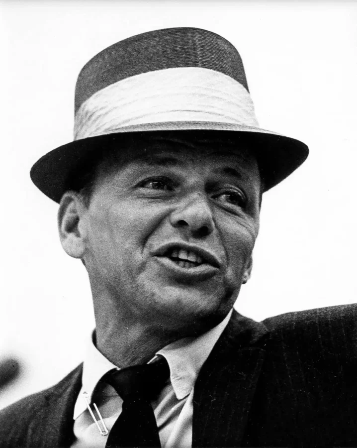 Frank Sinatra Straw Hat Poster showing in a light-banded straw hat, shown in close-up while speaking or reacting off camera.