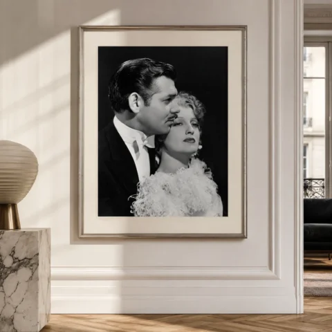 A framed black and white Clark Gable and Jeanette MacDonald San Francisco print hanging in a sophisticated home office.