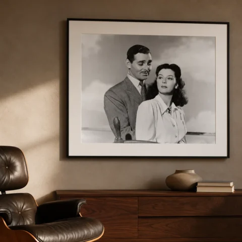 A sophisticated black and white Lana Turner art print framed in a modern living room setting alongside minimalist furniture.