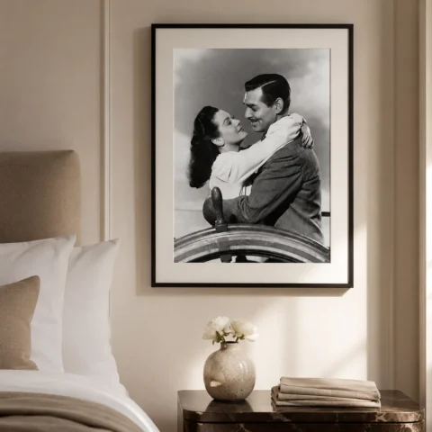 A framed Clark Gable art print displayed on a modern gallery wall in a sophisticated home office setting.