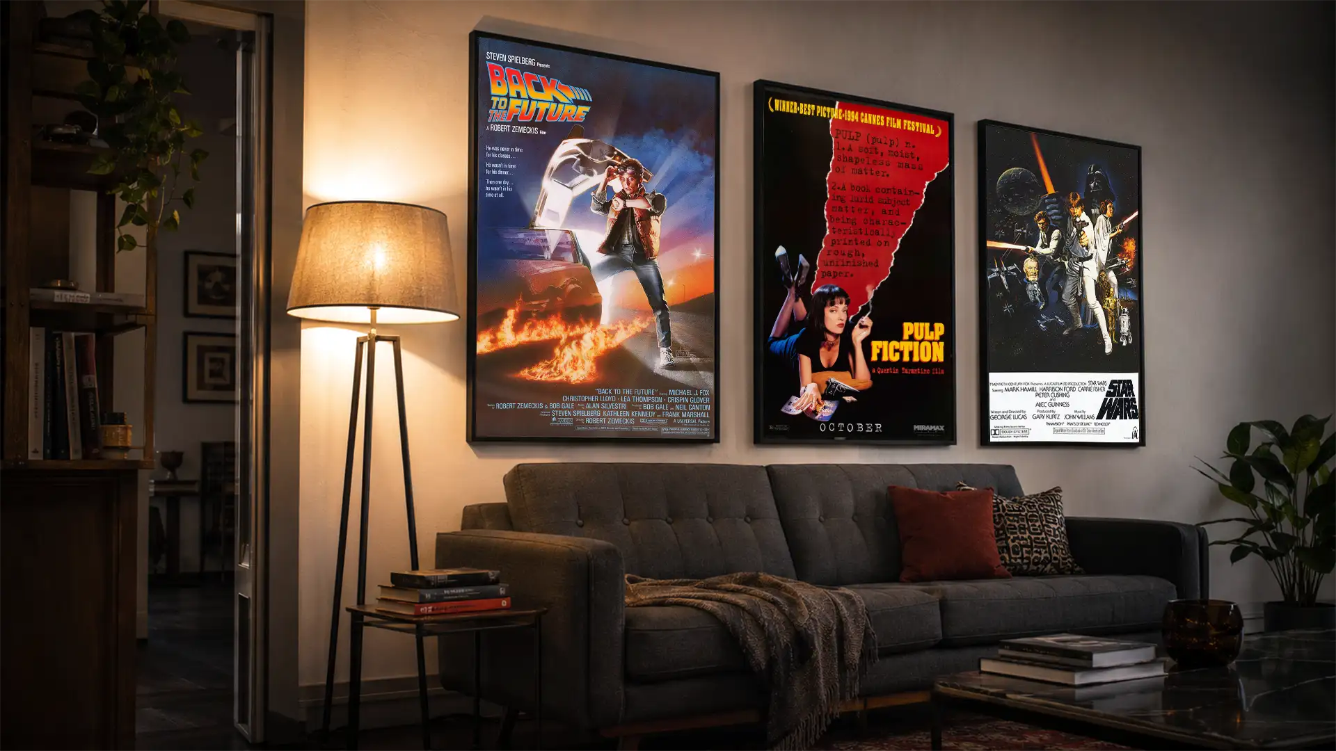 Gallery wall of framed movie posters in a home theater room, including vintage Star Wars and film noir prints