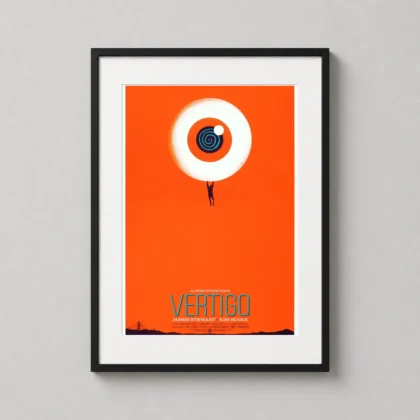 A minimalist Vertigo art print in a black frame hanging on a clean office wall above a mid-century modern desk.