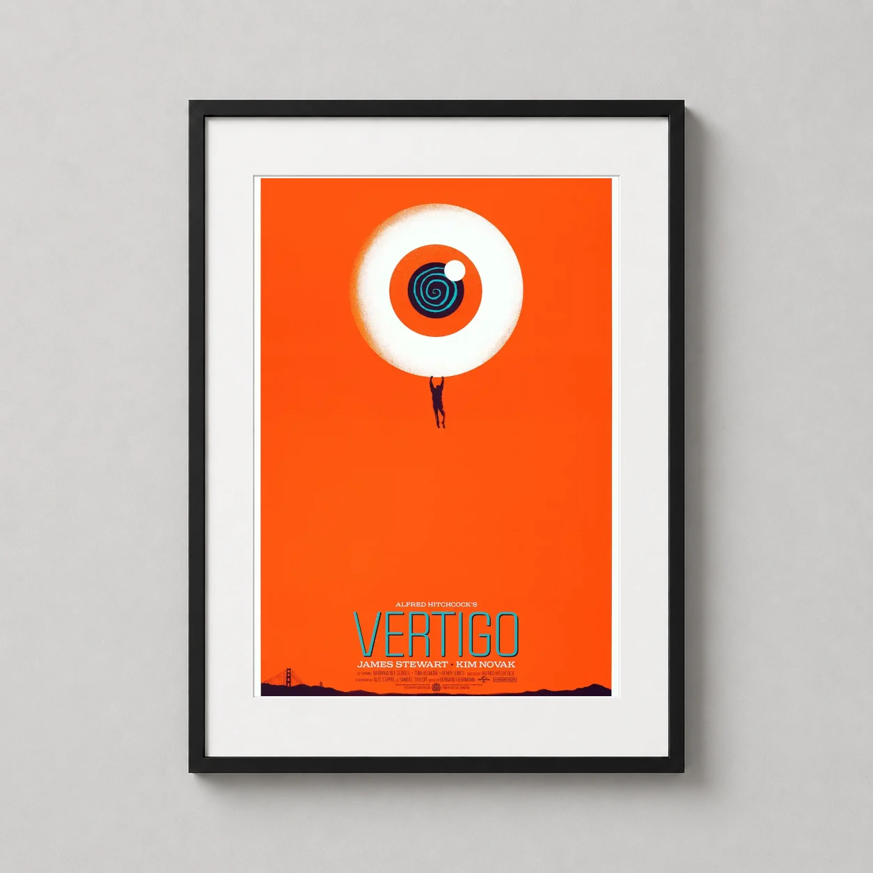 Room mockup of Alfred Hitchcock's Vertigo Mondo Movie Poster by Gary Pullin, Orange, displayed as framed wall art in a home theater setting as a portrait print with blue tones.