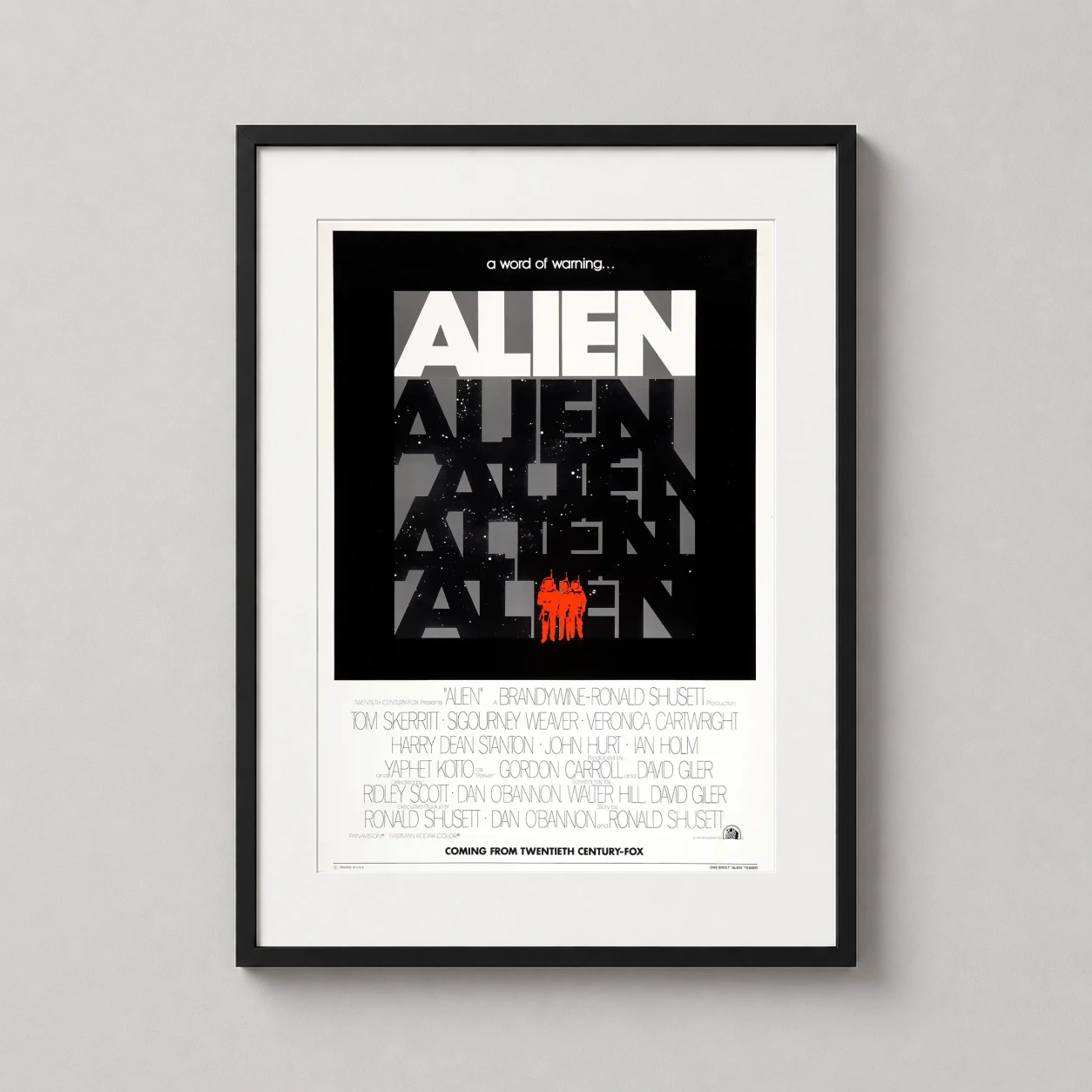 Room mockup of Alien 1979 Teaser Sci-Fi Space Horror Movie Poster, displayed as framed wall art in a home theater setting as a portrait print with red tones.