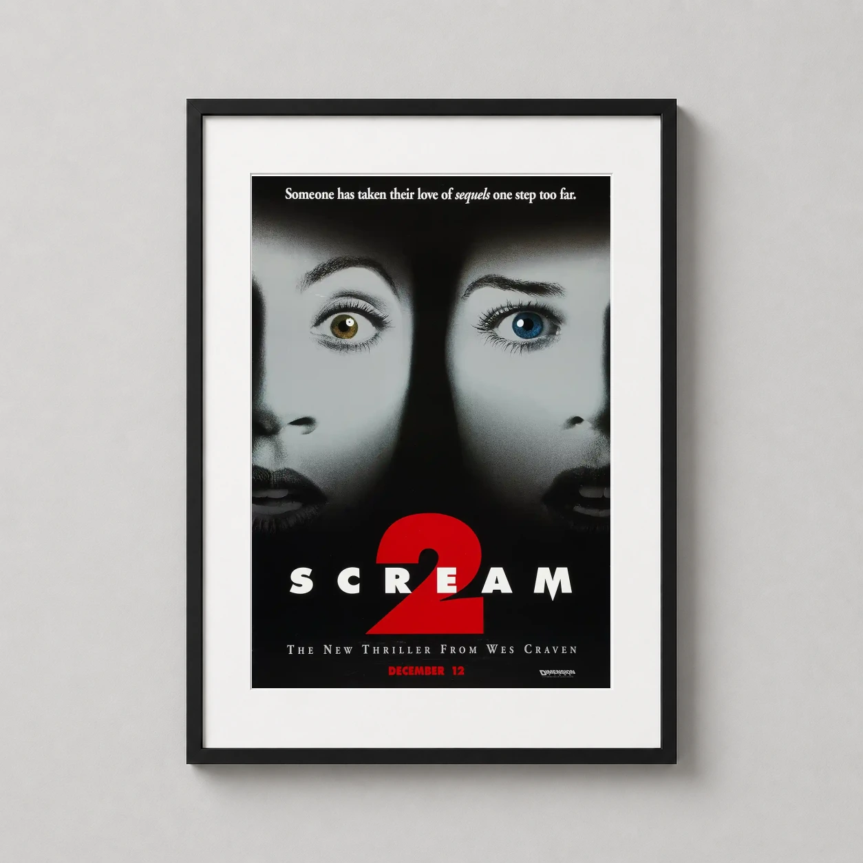 Room mockup of Scream 2 Dual-Face Eyes Key Art 1997 Horror Movie Poster, displayed as framed wall art in a home theater setting as a portrait print with blue and red tones.