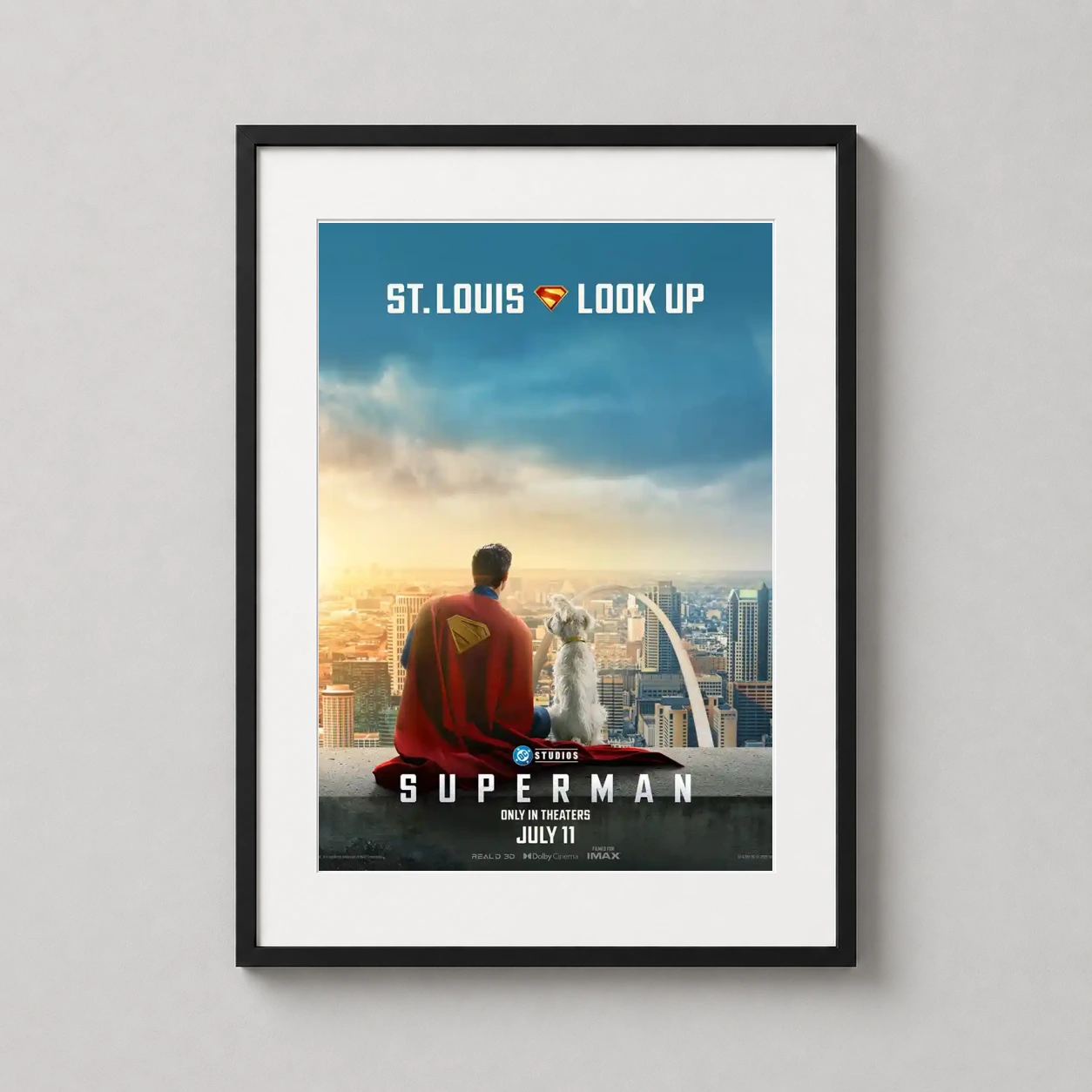 Superman 2025 St. Louis — superman and Krypto sit overlooking the St. Louis Gateway Arch in this