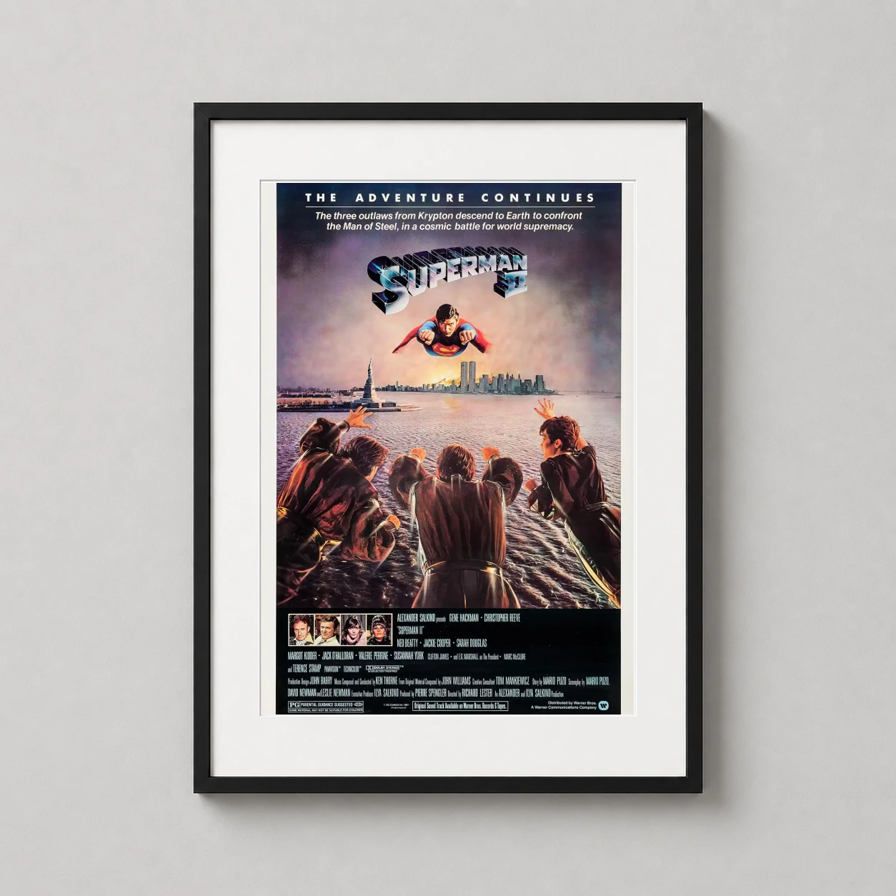 Room mockup of Superman II Classic Iconic Battle Movie Poster, displayed as framed wall art in a home theater setting as a portrait print.