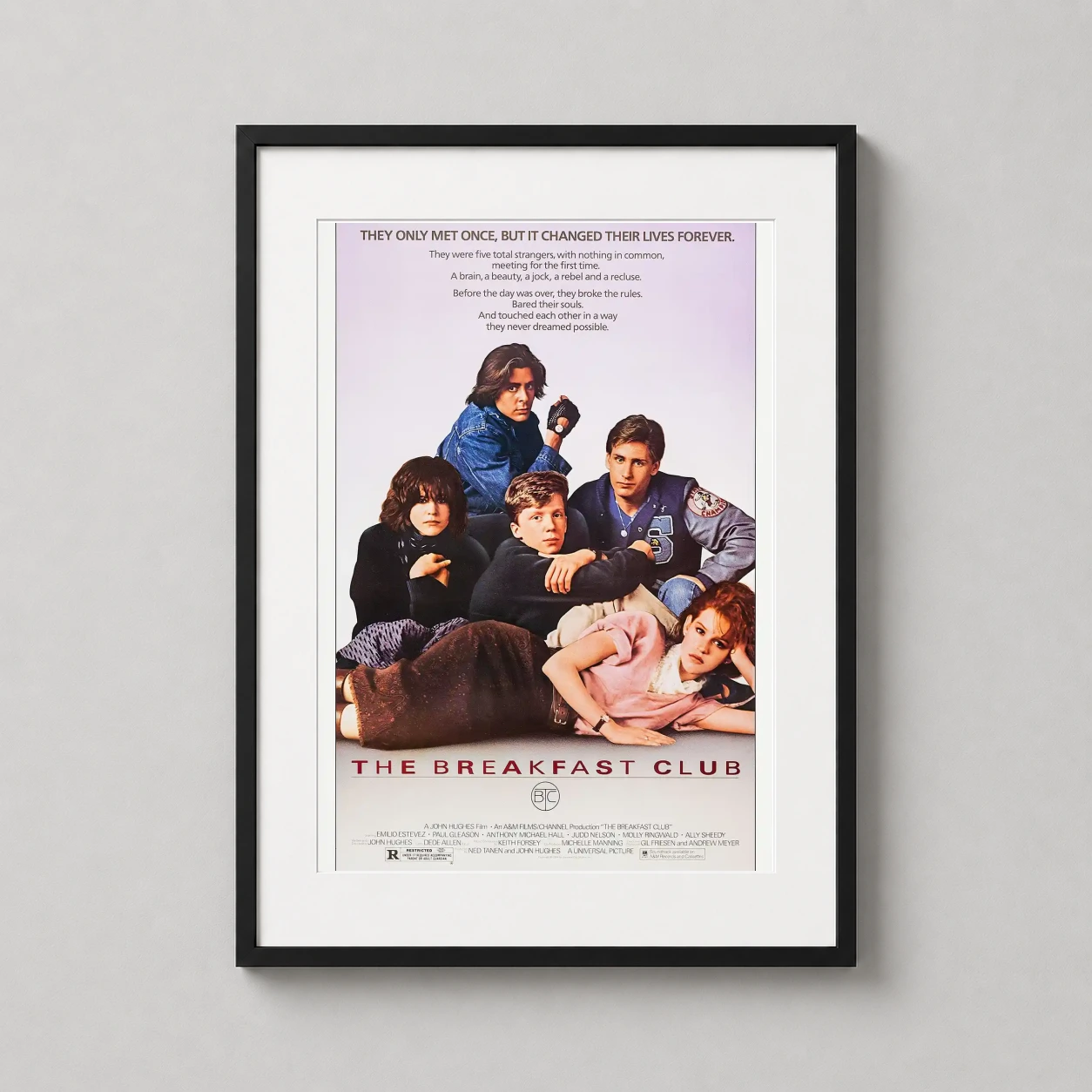 Room mockup of The Breakfast Club 1985 Classic 80s Film Poster, displayed as framed wall art in a home theater setting as a portrait print with purple and white tones.