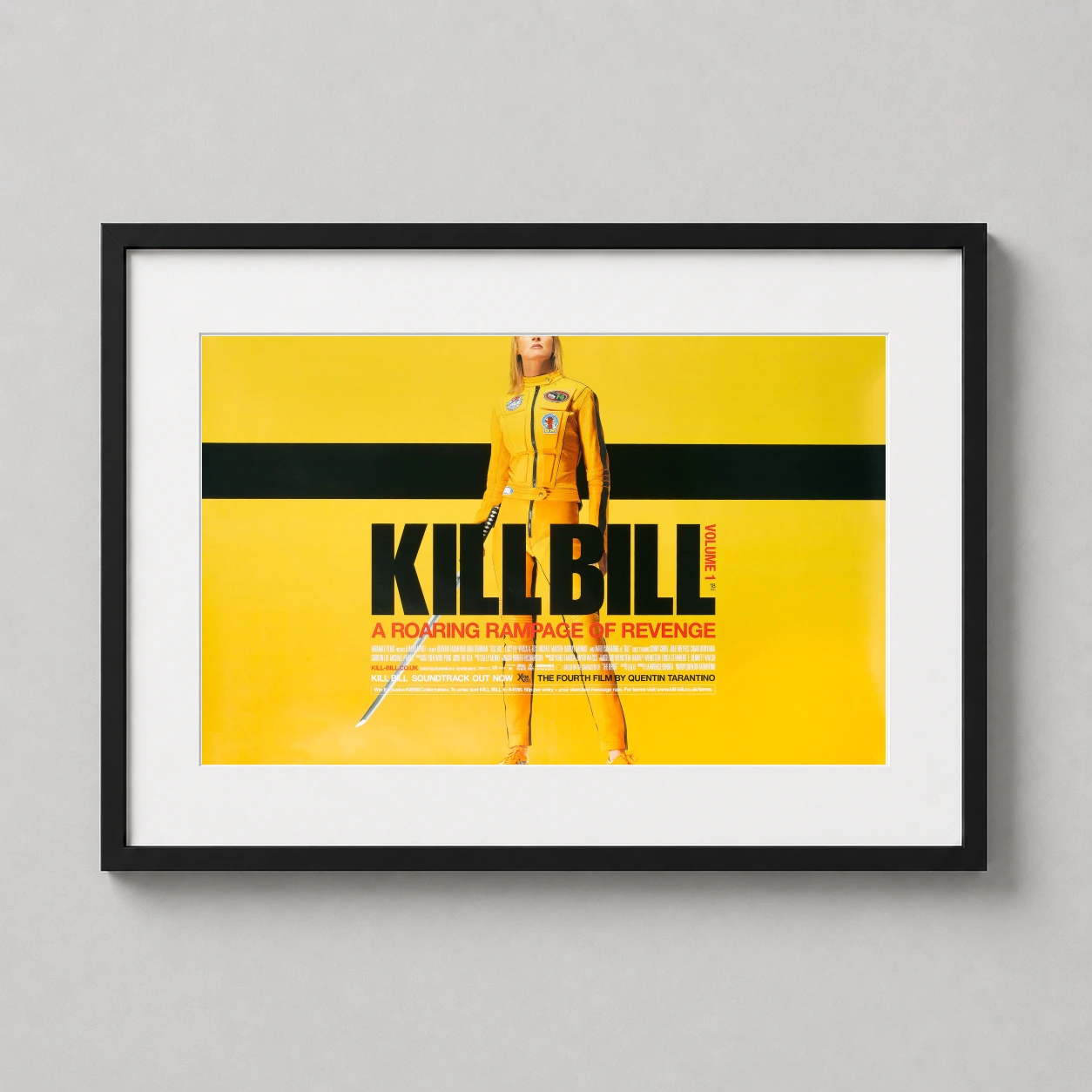Room mockup of Kill Bill Volume 1 The Bride Yellow Suit Movie Poster, displayed as framed wall art in a home theater setting as a landscape print with yellow tones.