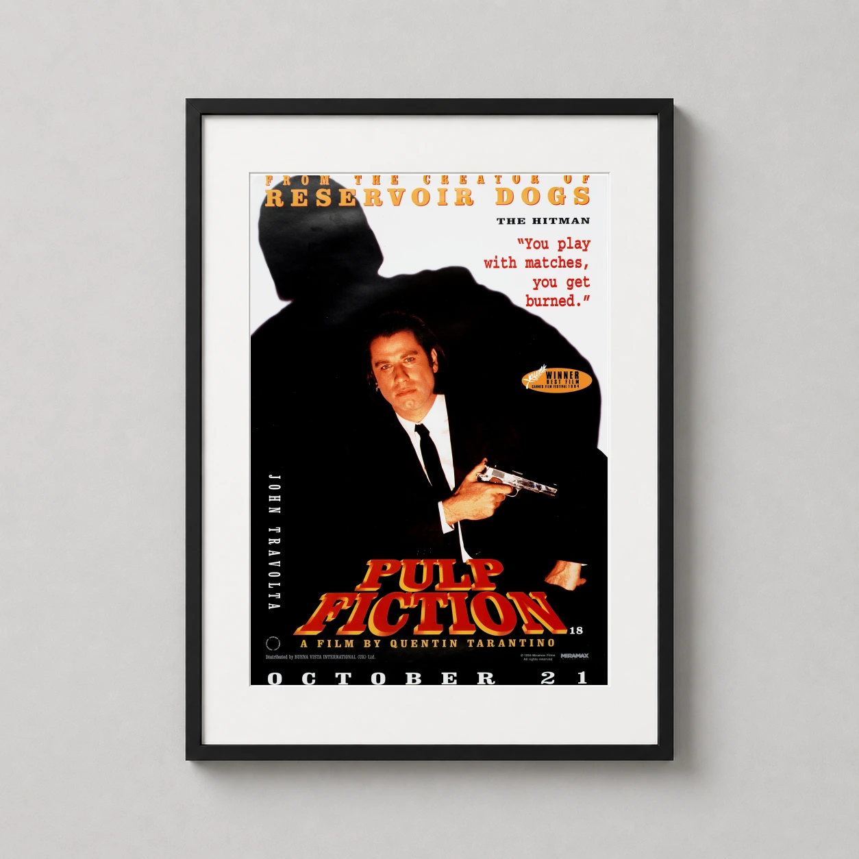 Room mockup of Pulp Fiction Vincent Vega Quentin Tarantino Movie Poster, displayed as framed wall art in a home theater setting as a portrait print with red tones.