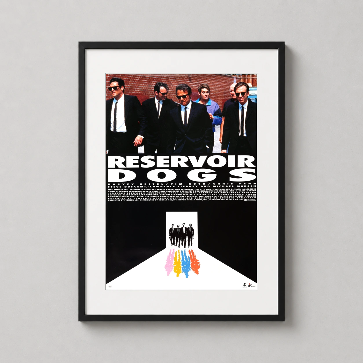 Room mockup of Reservoir Dogs Movie Poster Quentin Tarantino Suit Walk Print, displayed as framed wall art in a home theater setting as a portrait print with blue and black tones.