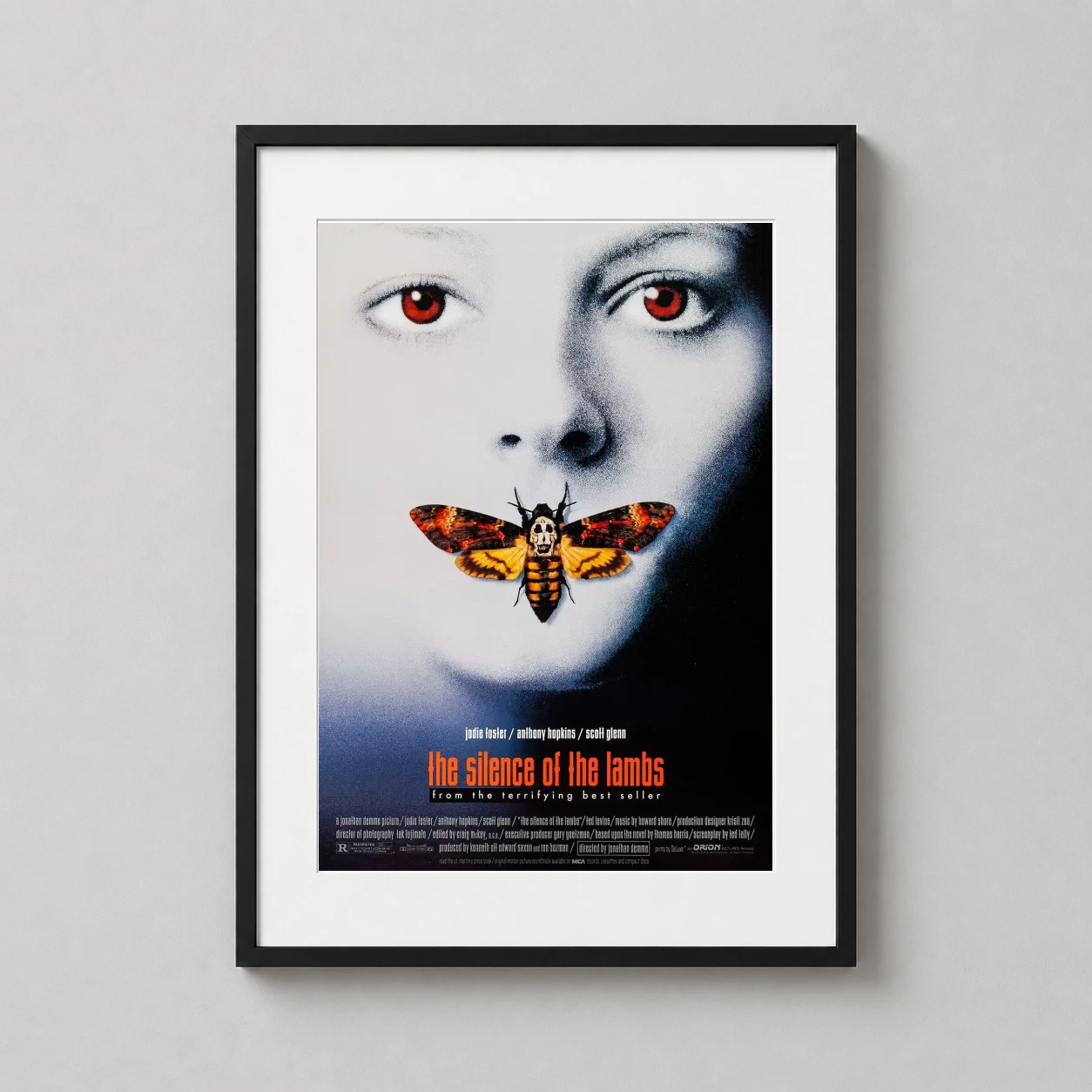 Silence of the Lambs — this horror movie poster features the pale face of Clarice Starling
