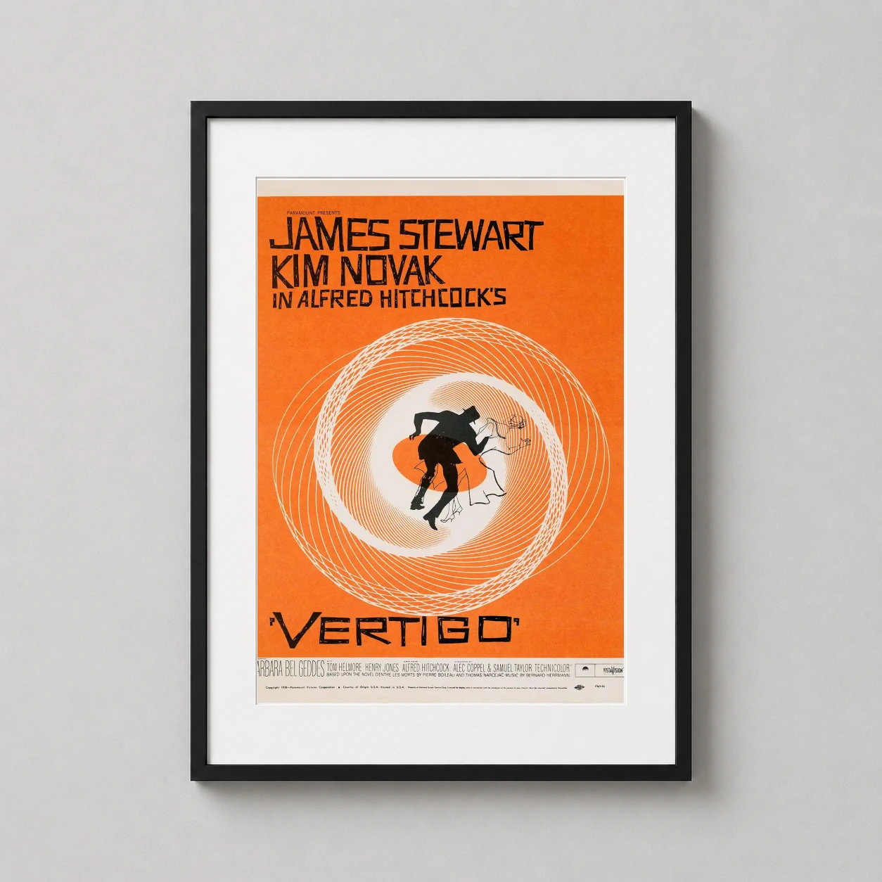 Vertigo 1958 Alfred Hitchcock — vibrant orange vintage film poster for Hitchcock’s Vertigo featuring