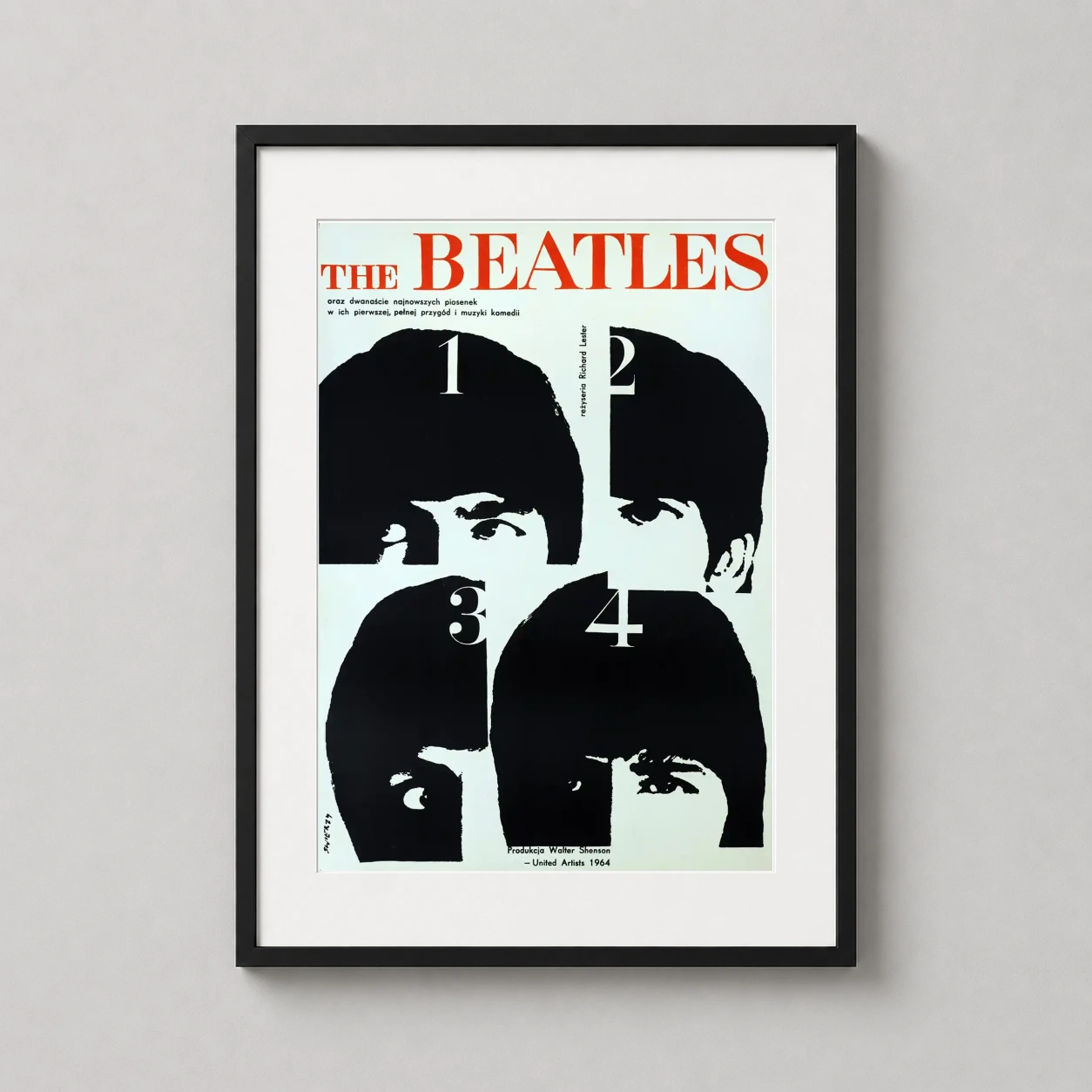 Room mockup of A Hard Day's Night Polish Beatles Movie Poster, displayed as framed wall art in a home theater setting as a portrait print with black and white and red tones.