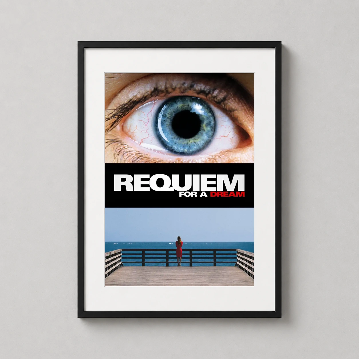 Requiem a Dream — striking movie poster featuring an extreme close-up of a blue eye with