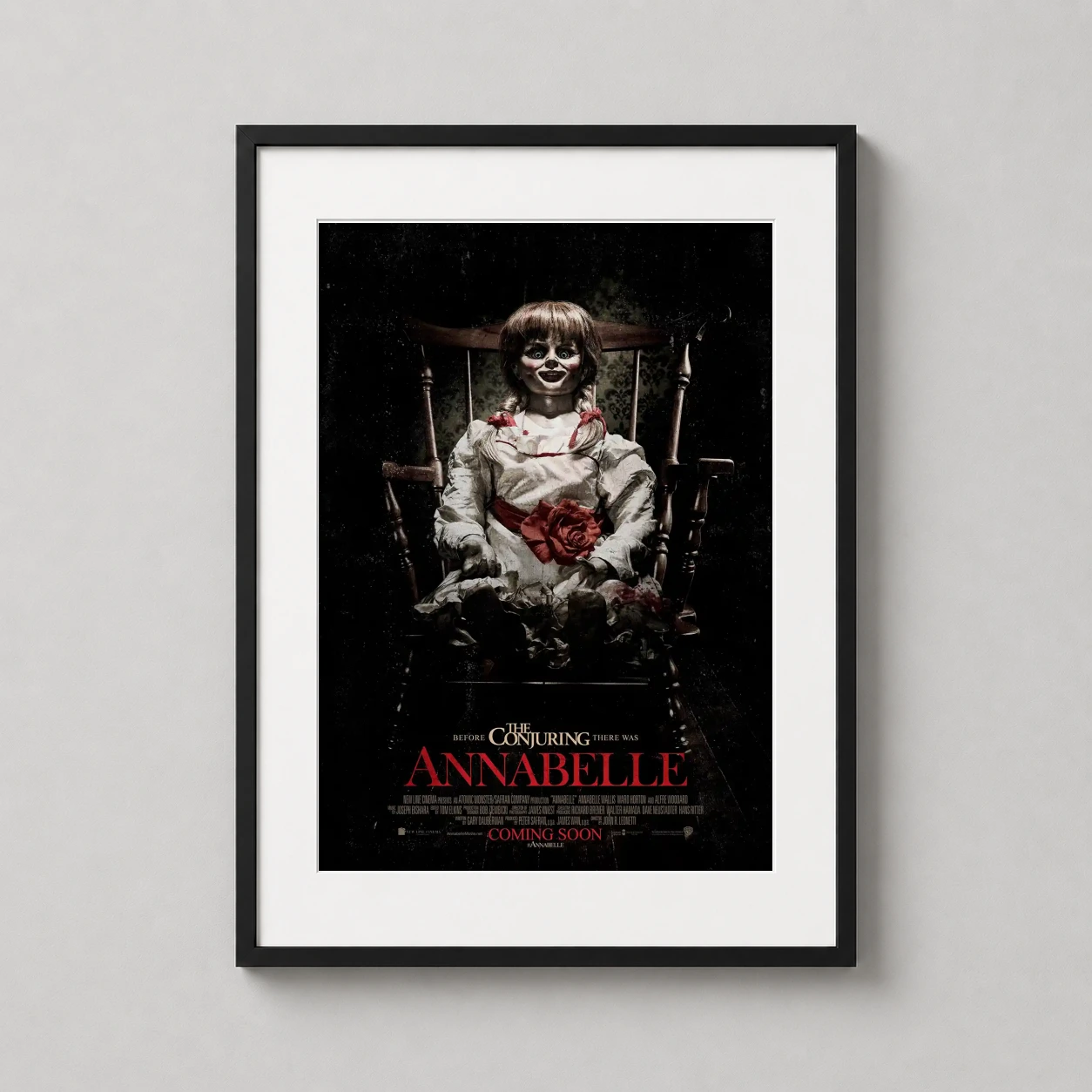 Annabelle — haunting depiction of the possessed Annabelle doll sitting in a wooden