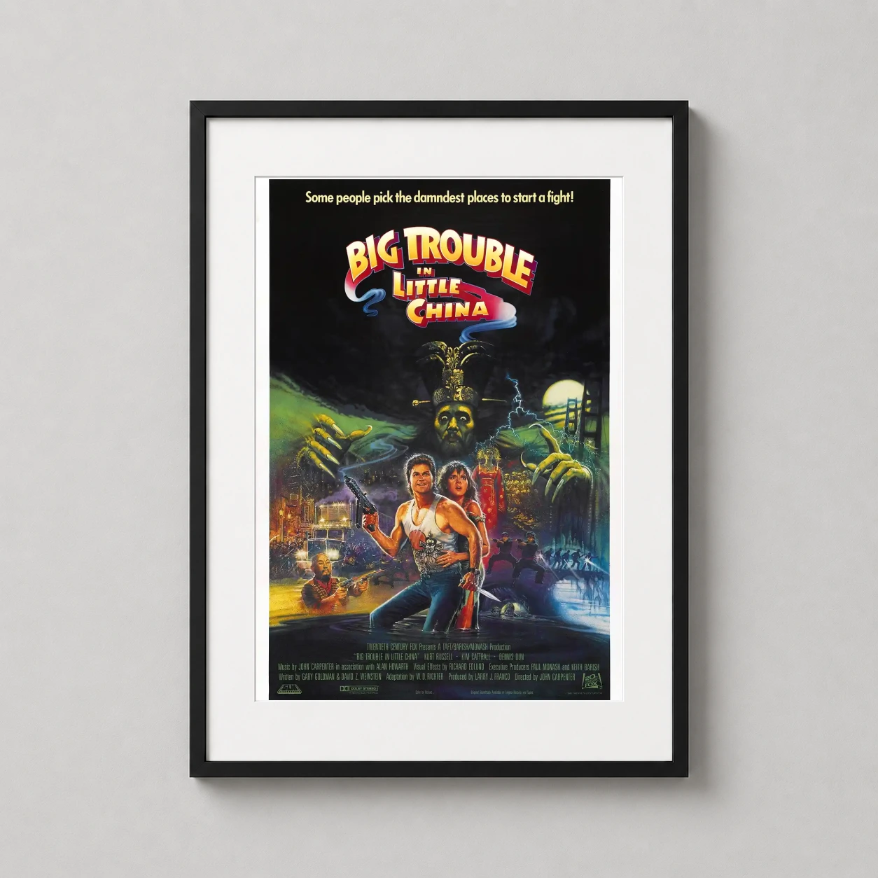 Room mockup of Big Trouble in Little China 1986 Retro Action Movie Poster, displayed as framed wall art in a home theater setting as a portrait print with green tones.