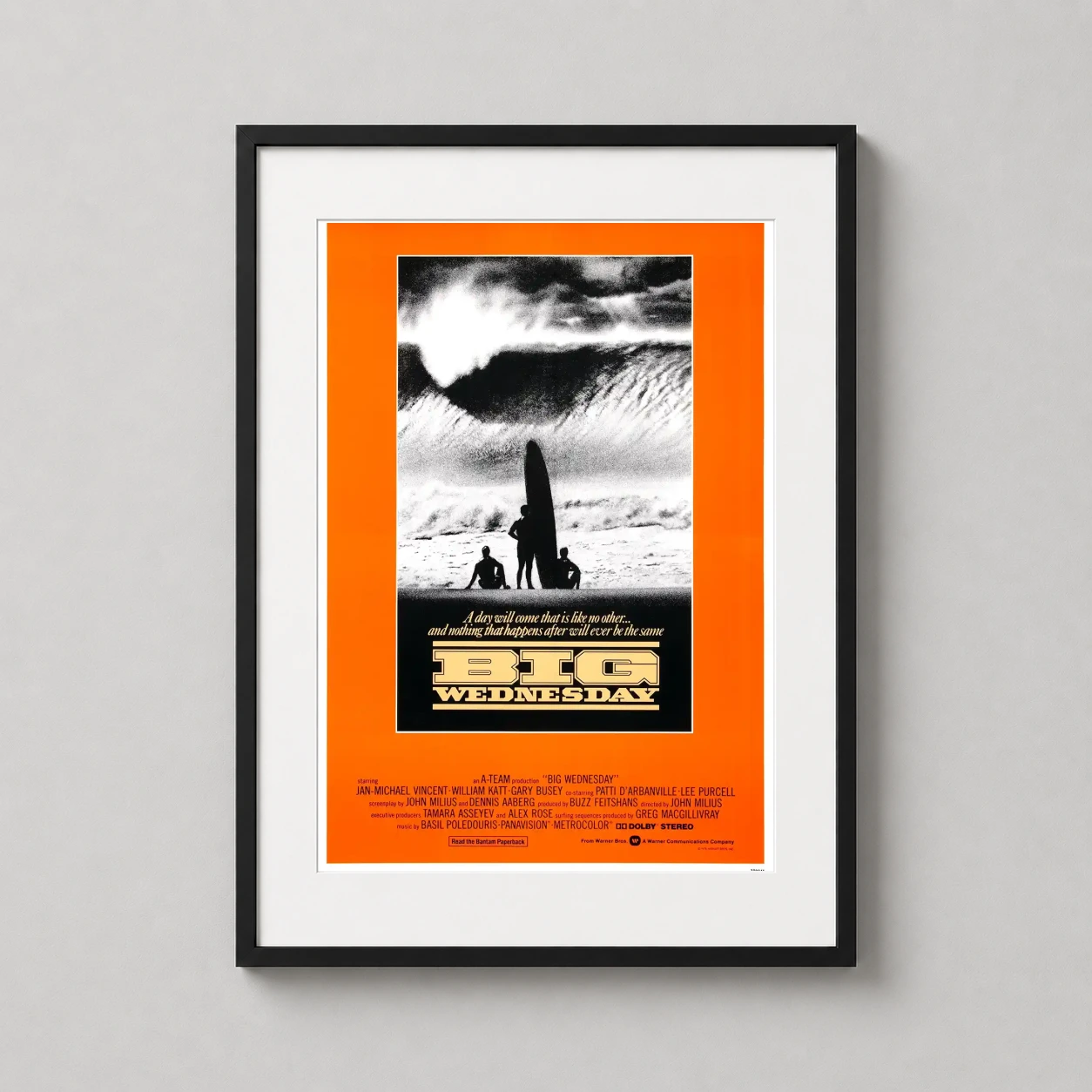 Big Wednesday — featuring a massive crashing wave and three silhouetted surfers, this