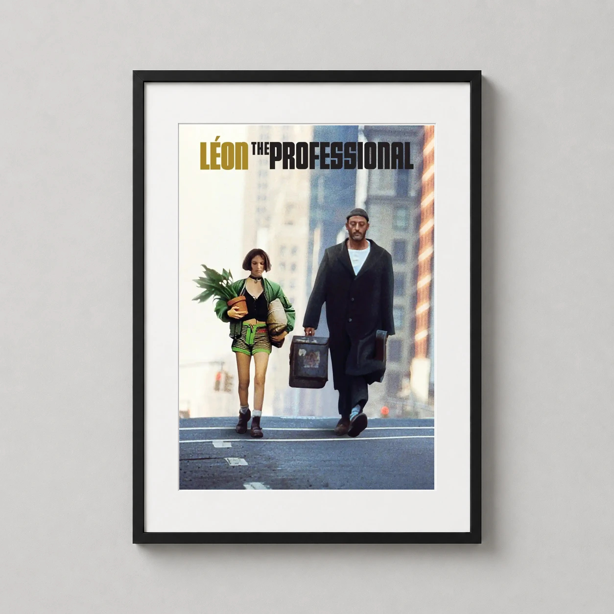 Leon the Professional — high-contrast film still featuring Léon and Mathilda walking through