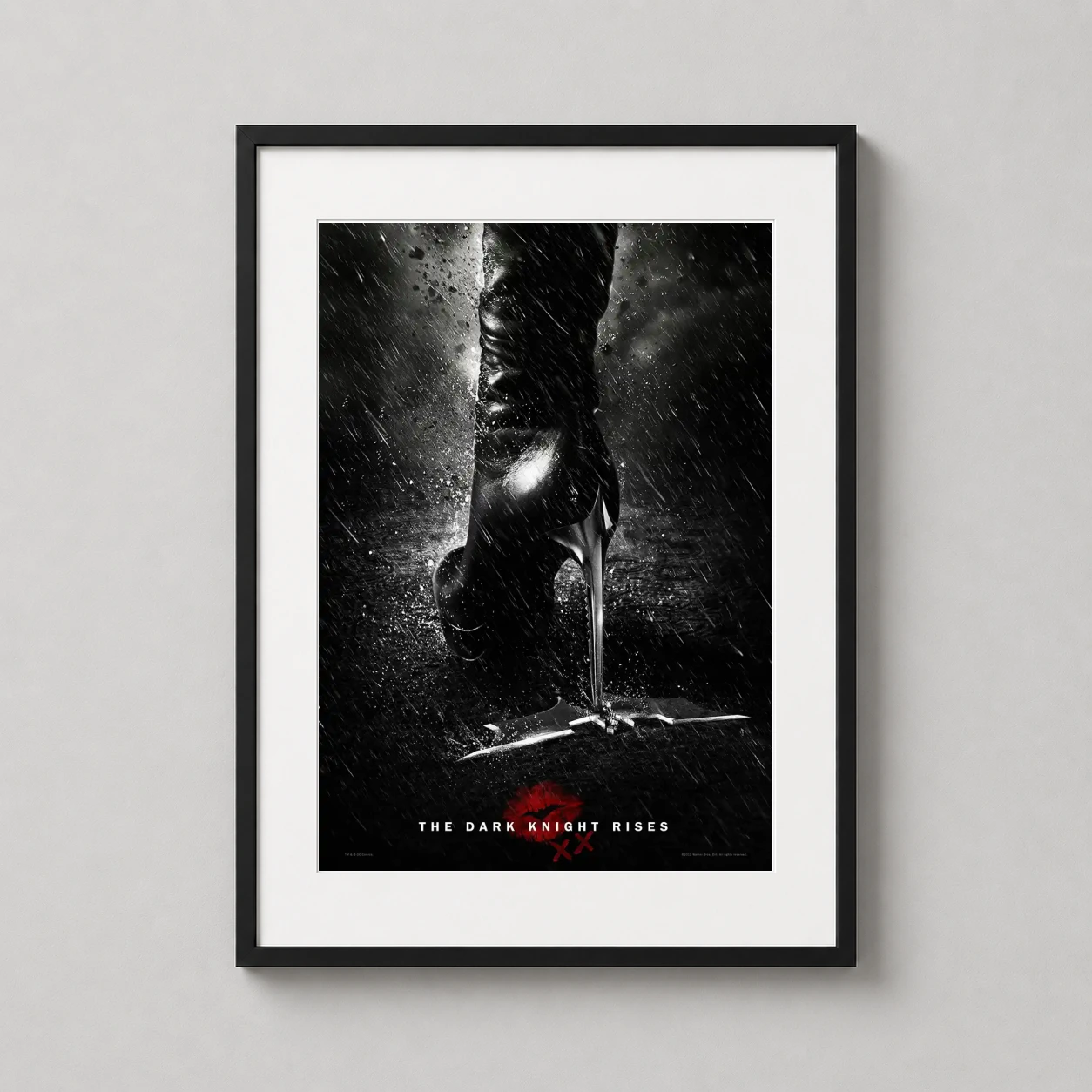 Room mockup of Catwoman The Dark Knight Rises Heel and Batarang Movie Poster, displayed as framed wall art in a home theater setting as a portrait print with red tones.