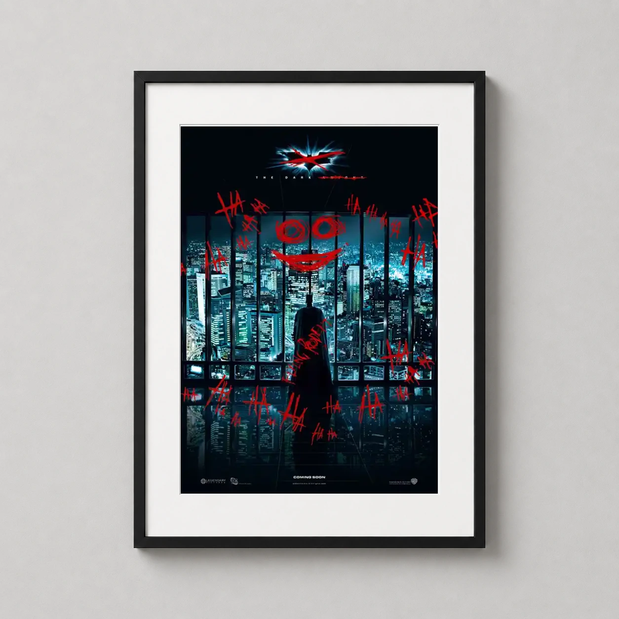 Room mockup of The Dark Knight Gotham City Joker Graffiti Movie Poster, displayed as framed wall art in a home theater setting as a portrait print with blue and red tones.
