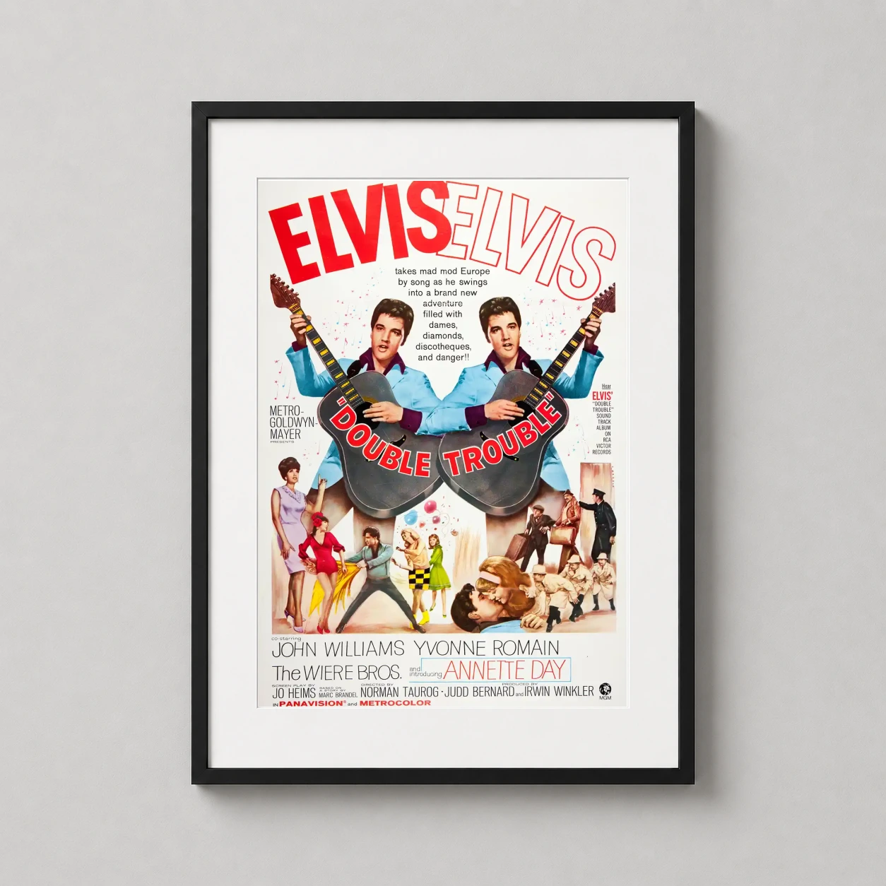 Double Trouble — this colorful vintage movie poster for Double Trouble features Elvis