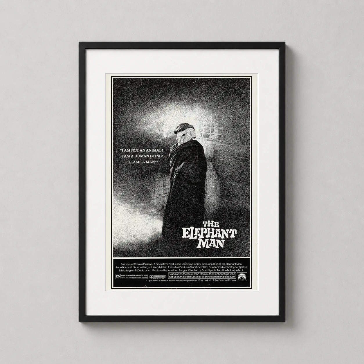 Elephant Man — stark black and white drama movie poster featuring the hooded figure of