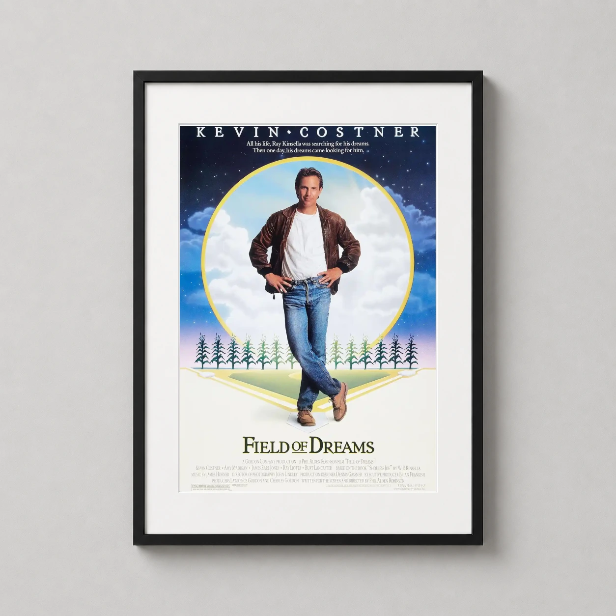 Field of Dreams — kevin Costner stands before a glowing circular Iowa cornfield and