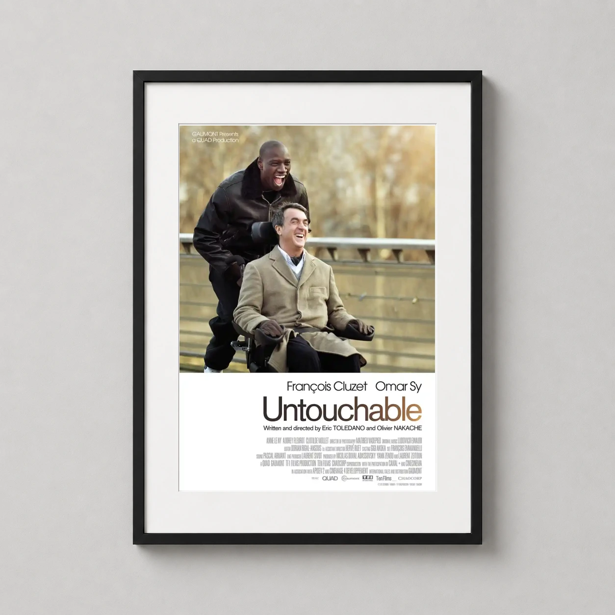Untouchable — heartwarming photographic movie poster featuring Driss and Philippe