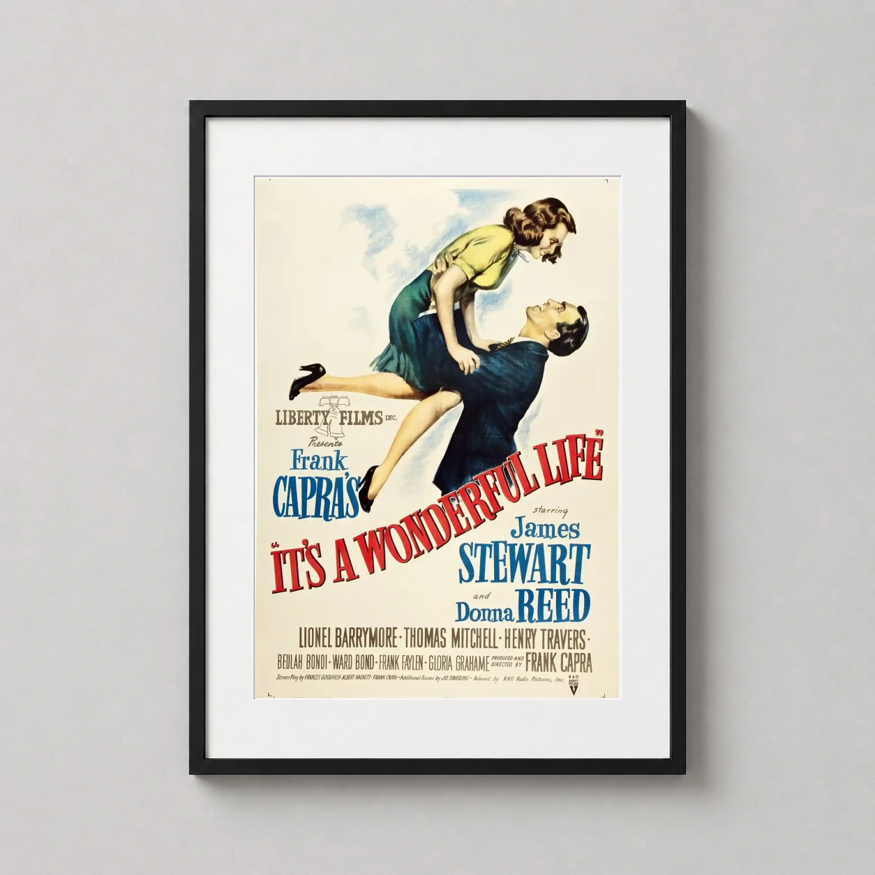 James Stewart and Donna Reed — this vintage movie poster depicts George Bailey lifting Mary Hatch in a