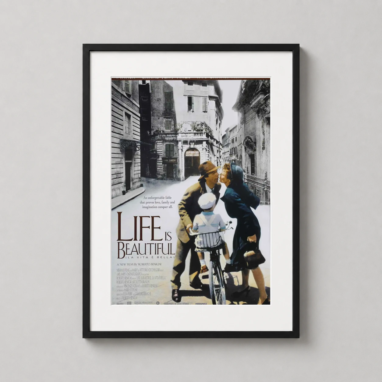 Life Is Beautiful — features the heartwarming image of Guido, Dora, and Giosuè on a bicycle
