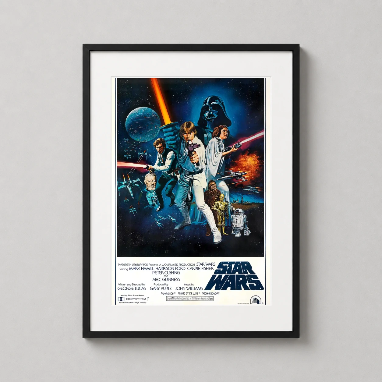 Room mockup of Star Wars A New Hope 1977 Style C Theatrical Movie Poster, displayed as framed wall art in a home theater setting as a portrait print with gold tones.