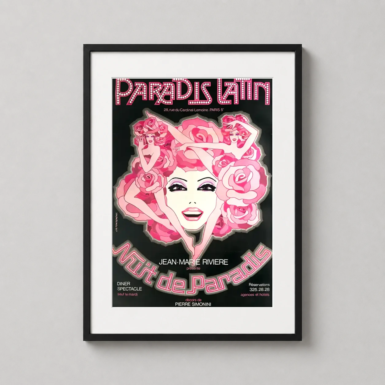 Room mockup of Paradis Latin Nuit de Paradis Vintage French Cabaret Movie Poster, displayed as framed wall art in a home theater setting as a portrait print with pink and black tones.