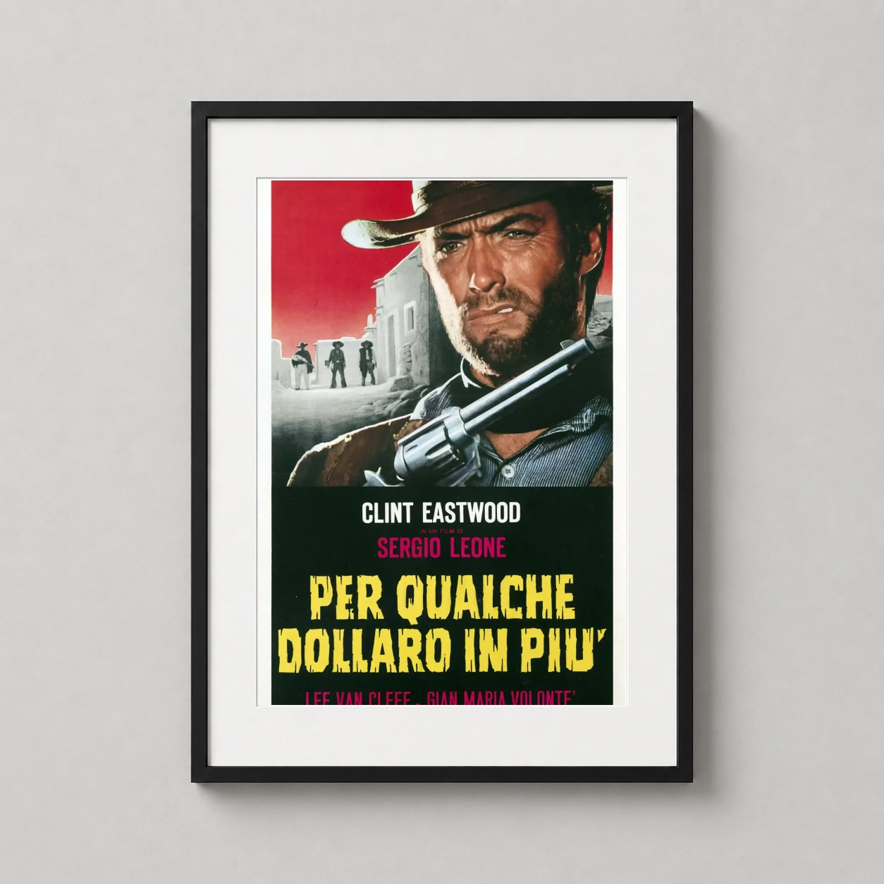 A Few Dollars More — featuring the intense gaze of Clint Eastwood and a drawn revolver, this
