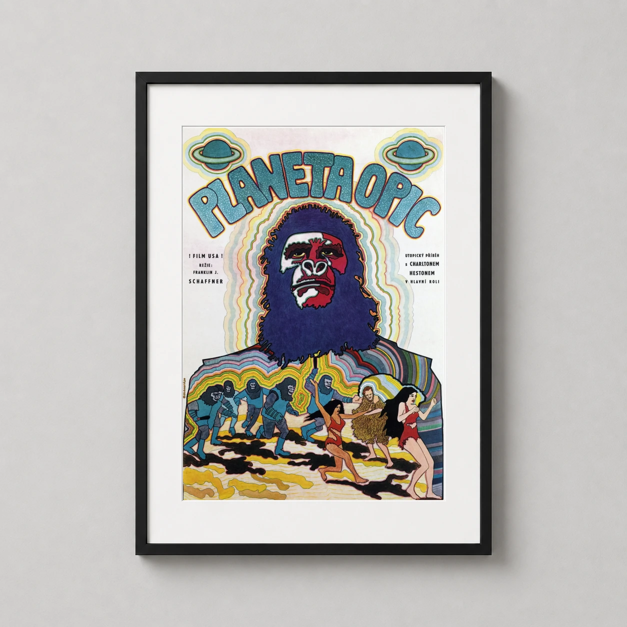 Room mockup of Planet of the Apes 1968 Czech Psychedelic Movie Poster, displayed as framed wall art in a home theater setting as a portrait print with blue and purple tones.