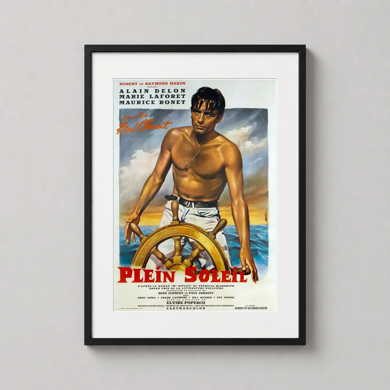 Plein Soleil — this vintage film poster features a sun-bronzed Alain Delon at a wooden